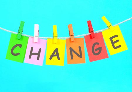 Change word on colorful paper hanging on a thread using clothespin.